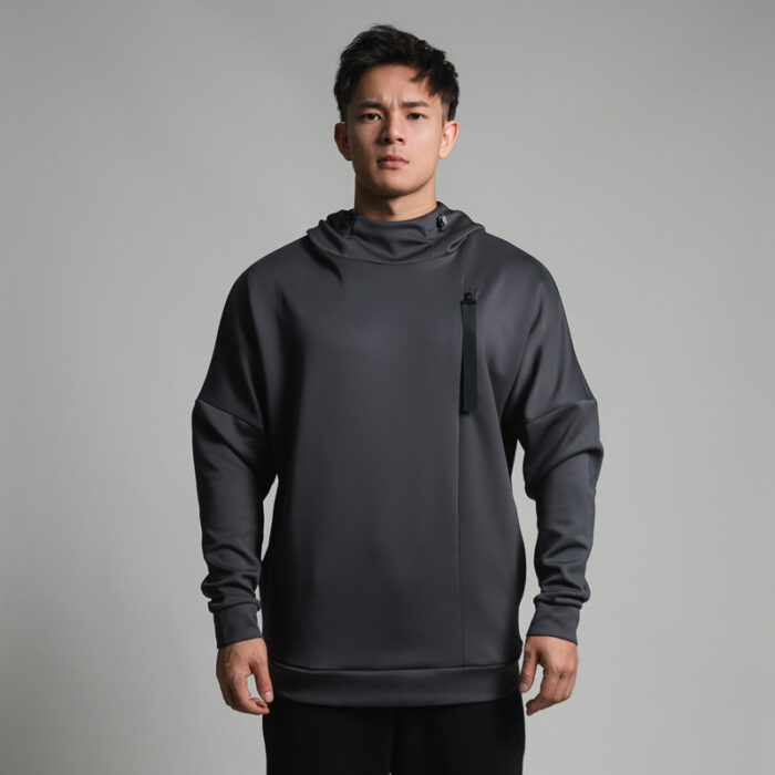 Stylish young man wearing a trendy mens loose high neck sweater.