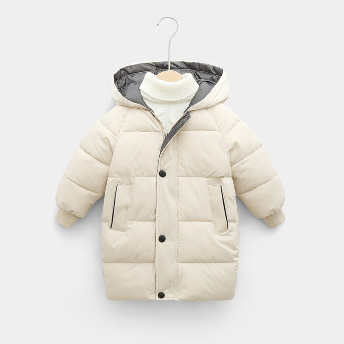 250747962660.jpg A happy child staying warm in the snow wearing a stylish kids thick winter coat.