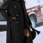 Close-up of the adjustable belt and classic lapel on a double breasted coat for women.