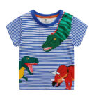 A happy little boy wearing a comfortable boys cotton dinosaur t shirt for everyday summer play.