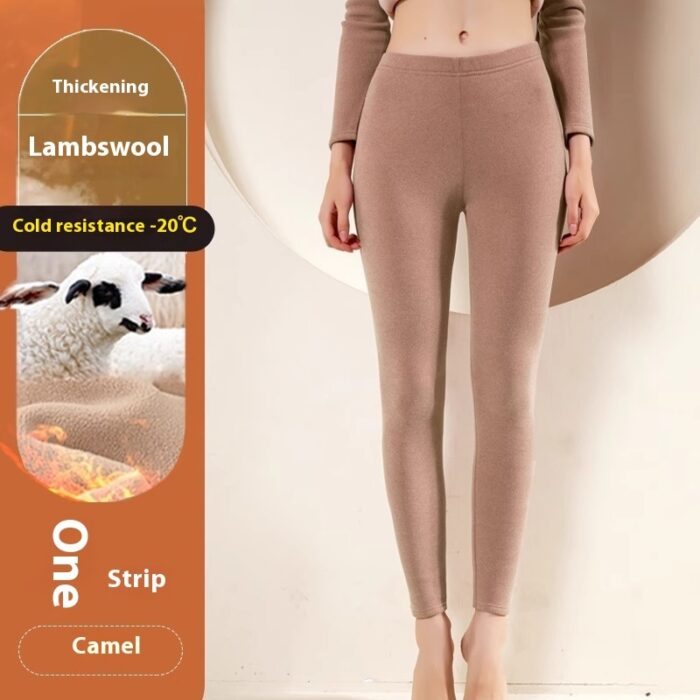 Stylish woman staying warm in thick womens thermal winter leggings for travel.