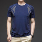 A man staying cool in the summer heat wearing a breathable mens ice silk t shirt.
