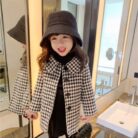 A cute toddler wearing a stylish toddler fall and winter coat for cold weather.