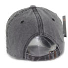 Close-up of the premium breathable cotton and classic curved brim on a distressed classic dad hat.