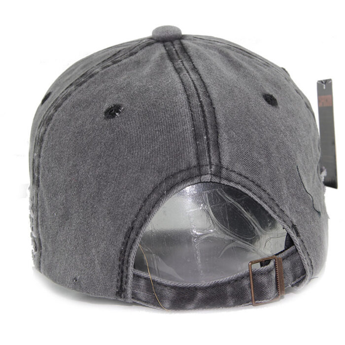 Close-up of the premium breathable cotton and classic curved brim on a distressed classic dad hat.