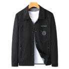 A stylish man wearing a sleek mens wrinkle free casual jacket for a smart everyday look.