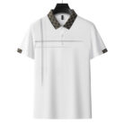 A professional man wearing a classic mens cotton polo shirt ph for a smart casual office look.