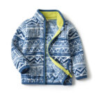 A happy child wearing a comfortable kids lightweight zip up jacket ready for outdoor play.