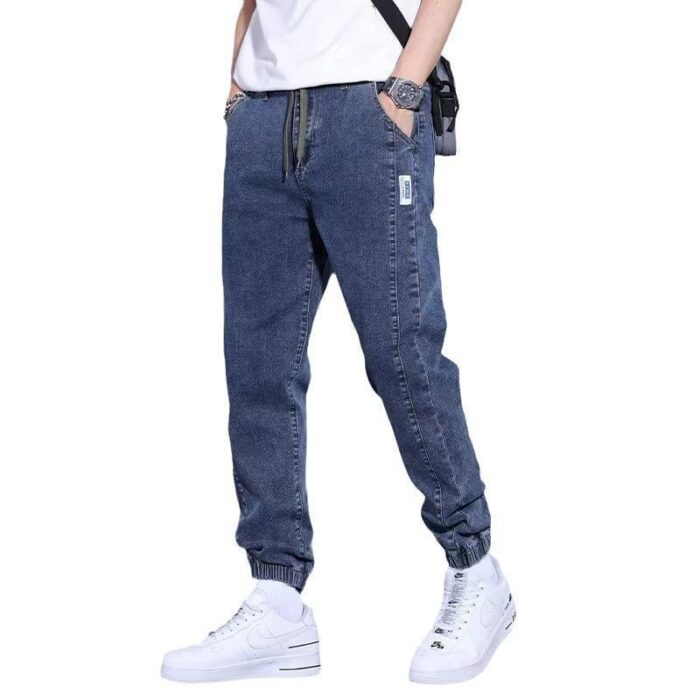 3a950913-27e0-4d80-89d3-aa9fdbe7601b.jpg Stylish young man wearing comfortable mens denim jogger pants.