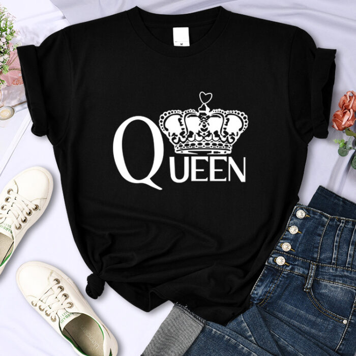 3c499ed0-6e37-41ba-af97-02b05a763c48.jpg Close-up of the bold crown print and breathable fabric on a crown print cotton shirt.