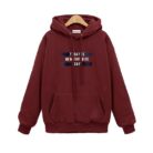 Stylish young woman wearing a trendy womens oversized letter print hoodie for everyday casual wear.