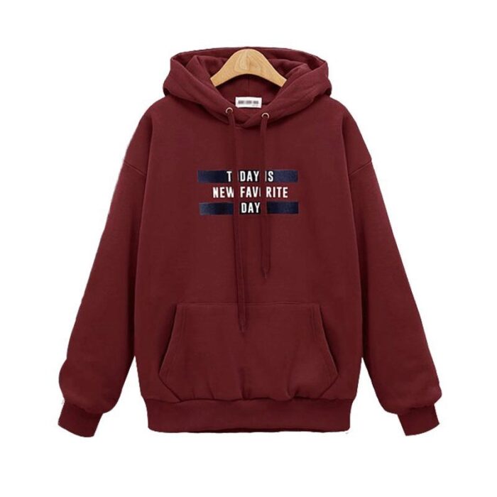Stylish young woman wearing a trendy womens oversized letter print hoodie for everyday casual wear.