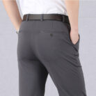 A stylish man wearing perfectly tailored mens high waist trousers ph for a smart casual look.