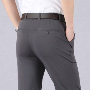 A stylish man wearing perfectly tailored mens high waist trousers ph for a smart casual look.