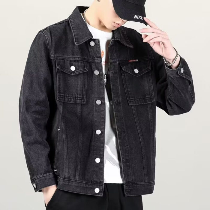 A stylish man wearing a versatile mens vintage distressed denim jacket for an edgy streetwear look.