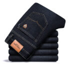 Handsome young man wearing comfortable mens straight leg jeans.
