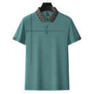 A professional man wearing a classic mens cotton polo shirt ph for a smart casual office look.