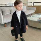 A cute toddler wearing a stylish toddler fall and winter coat for cold weather.
