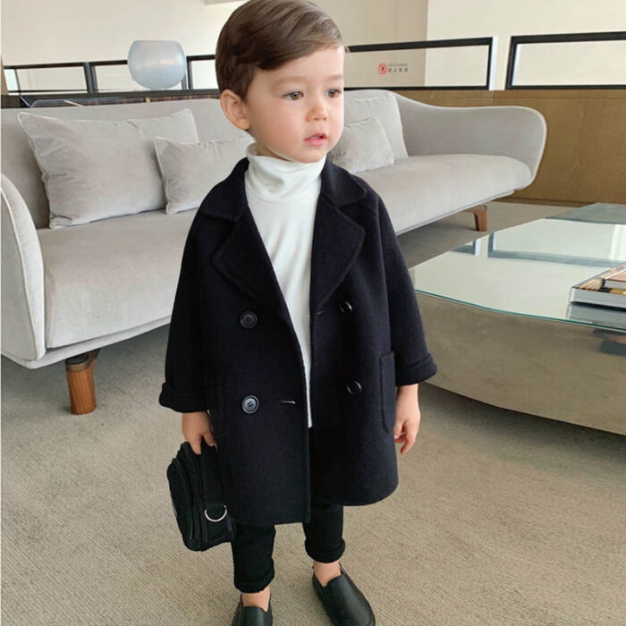 A cute toddler wearing a stylish toddler fall and winter coat for cold weather.