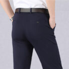 A stylish man wearing perfectly tailored mens high waist trousers ph for a smart casual look.