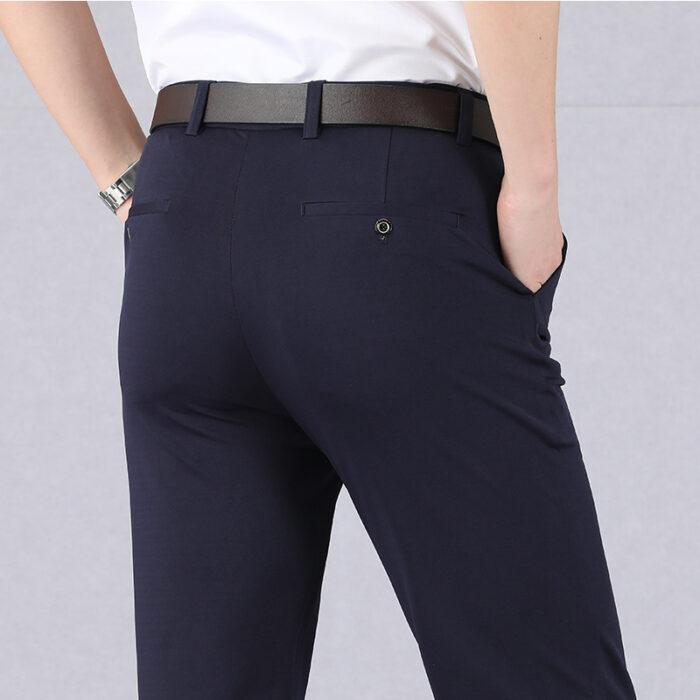 56eaf6f0-c001-47e5-938c-b13b1fb72e8d.jpg A stylish man wearing perfectly tailored mens high waist trousers ph for a smart casual look.