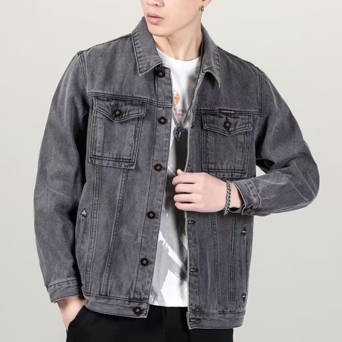 A stylish man wearing a versatile mens vintage distressed denim jacket for an edgy streetwear look.