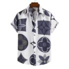 A stylish man wearing a classic mens short sleeve striped shirt for a casual summer look.