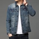 A stylish man wearing a trendy mens slim fit denim jacket for a sleek Korean streetwear look.