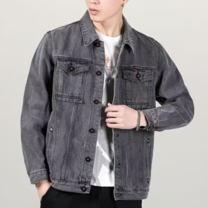 A stylish man wearing a versatile mens vintage distressed denim jacket for an edgy streetwear look.
