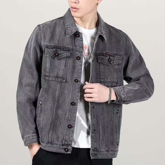 A stylish man wearing a versatile mens vintage distressed denim jacket for an edgy streetwear look.