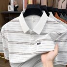 A stylish man wearing a comfortable mens striped polo shirt for a smart casual weekend look.