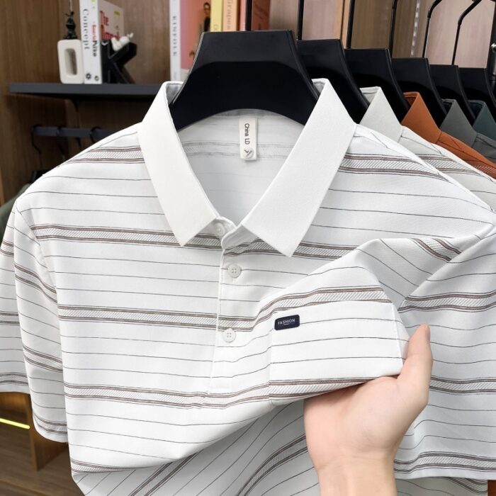 A stylish man wearing a comfortable mens striped polo shirt for a smart casual weekend look.