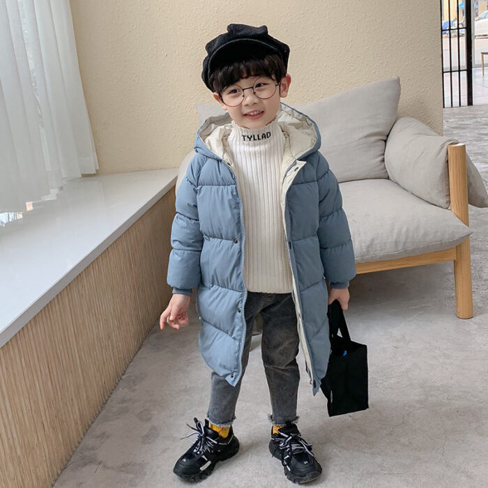 6252869815452.jpg A happy child staying warm in the snow wearing a stylish kids thick winter coat.