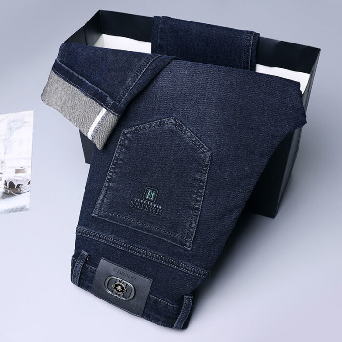 A stylish man wearing comfortable mens straight leg jeans ph for a business casual look.