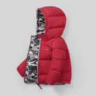 Close-up of the thick thermal cotton insulation and smooth zipper on a kids padded winter jacket.