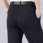 A stylish man wearing perfectly tailored mens high waist trousers ph for a smart casual look.