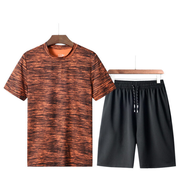 747475013083.jpg Athletic man working out wearing a breathable mens sports terno set.