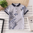 A handsome little boy wearing a breathable boys cotton polo shirt ph for a family weekend outing.