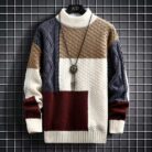 Stylish young man wearing a trendy mens korean style sweater.