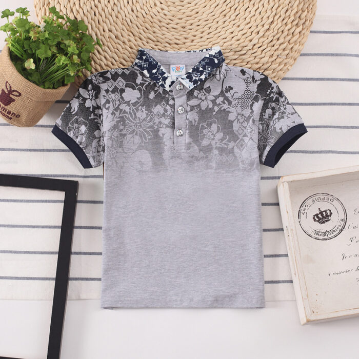 7db74ddd-5912-432c-b75a-1818292cd165.jpg A handsome little boy wearing a breathable boys cotton polo shirt ph for a family weekend outing.