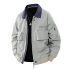 A stylish man wearing a loose fit mens retro pilot jacket for a casual streetwear look.