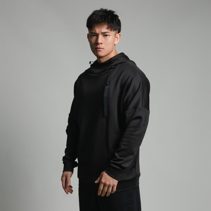 Stylish young man wearing a trendy mens loose high neck sweater.