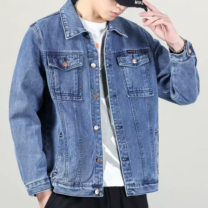 A stylish man wearing a versatile mens vintage distressed denim jacket for an edgy streetwear look.