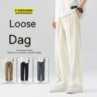 A stylish man wearing comfortable mens casual suit pants for a smart casual office look.