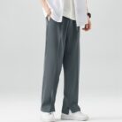 A stylish man wearing comfortable mens casual suit pants for a smart casual office look.