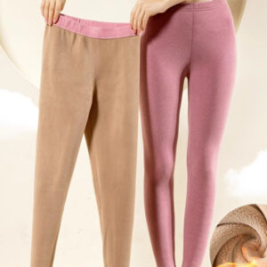 Stylish woman staying warm in thick womens thermal winter leggings for travel.