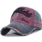 Close-up of the premium breathable cotton and classic curved brim on a distressed classic dad hat.