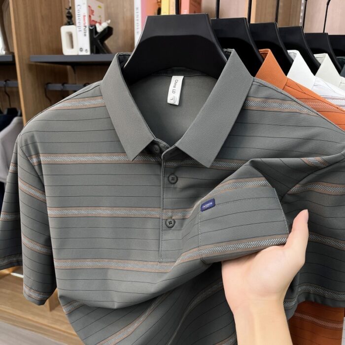 A stylish man wearing a comfortable mens striped polo shirt for a smart casual weekend look.