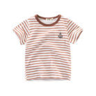 A cute child wearing a comfortable kids striped cotton t shirt for everyday summer play.