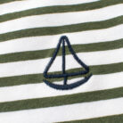 A cute child wearing a comfortable kids striped cotton t shirt for everyday summer play.